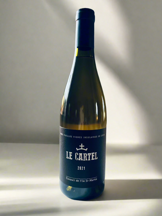 Bottle of Le Cartel Blanc de Noirs 2021 wine with a black label featuring the name and vintage, photographed on a minimalist surface with soft lighting.