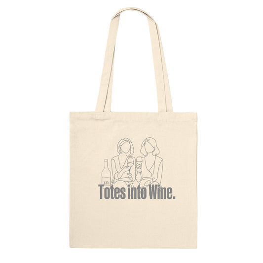 Natural canvas tote bag with 'Totes Into Wine' text and minimalist illustration of two women enjoying wine. Eco-friendly and perfect for wine lovers.